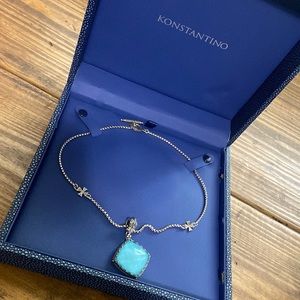 Konstantino chain with cross accents and blue stone pendant.